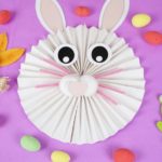 Paper fan bunny on purple background