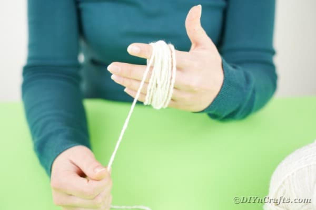 wrapping yarn around the palm of hand