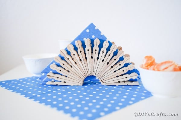 Clothespin napkin holder on blue and white polka dot cloth