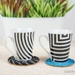 Black and white and blue coaster on table by potted plant