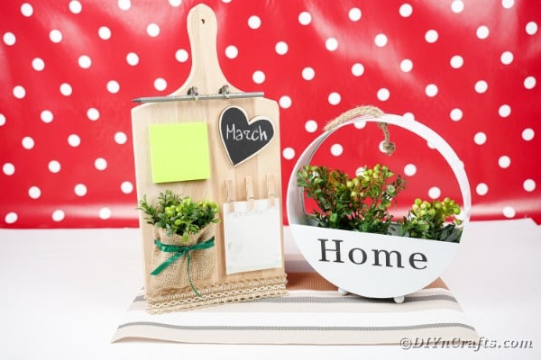 Cutting board by flower decor in front of red and white background