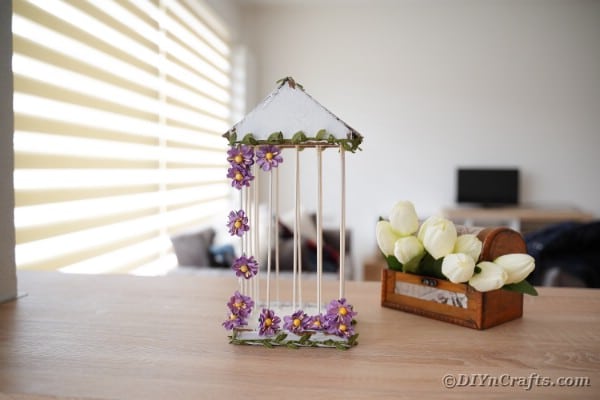 DIY birdcage on table by tulips
