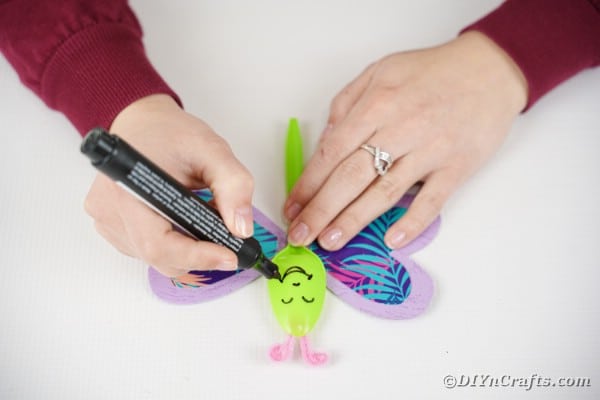 Drawing face onto butterfly