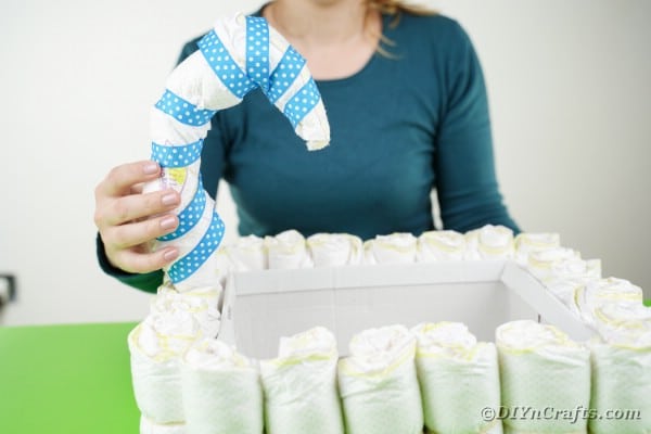 Attaching hook of diapers to box