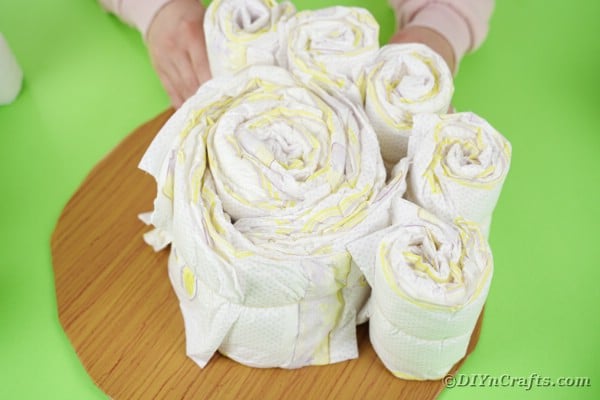Adding diaper rolls to cake base