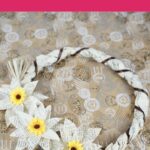 Old Book Page Wrapped Wreath on floral background