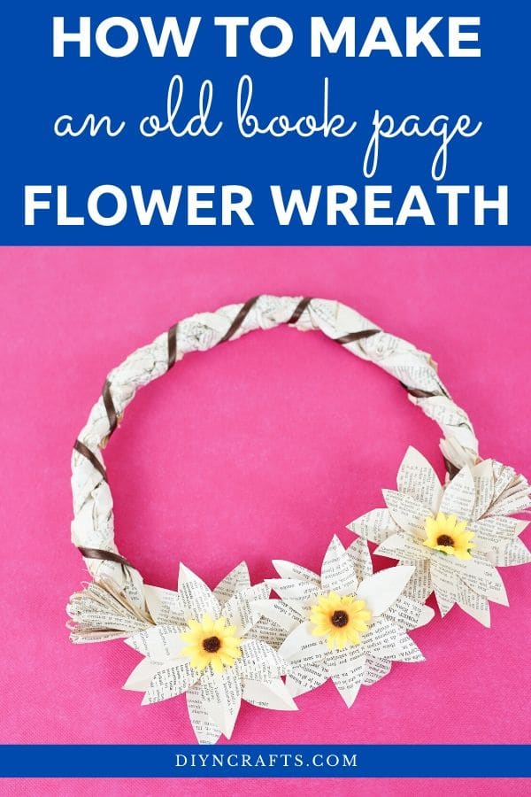 Grapevine wreath from book pages on pink surface