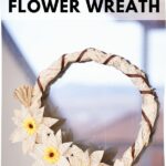 Book page grapevine wreath hanging on window