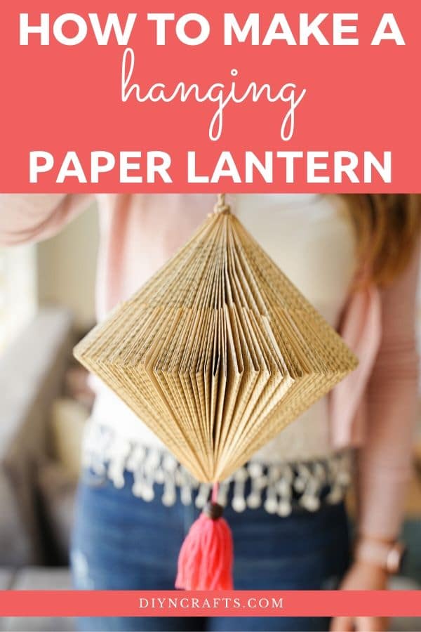 Woman holding paper lantern with pink tassel