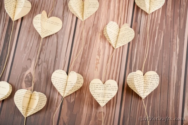 Hanging heart garland on brown wood table