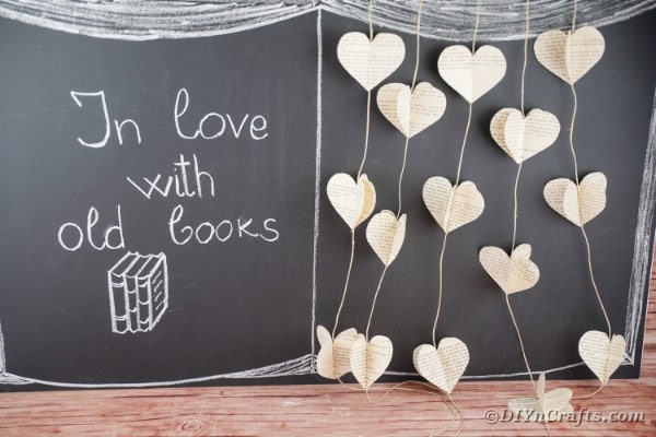 Paper heart garland against chalkboard