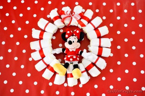 Minnie Mouse diaper wreath on red polka dot background