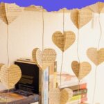 Heart garland hanging by bookshelf