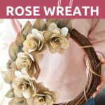 Woman holding book page wreath