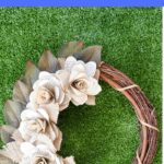 Book page wreath on grass