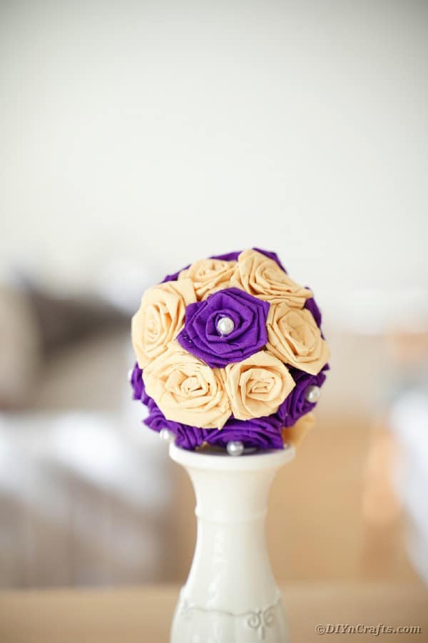 Tissue paper rose ball on candlestick