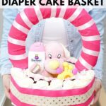 Woman holding a diaper basket gift