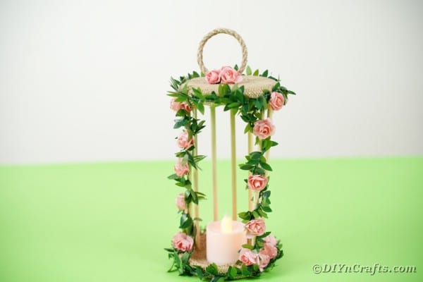 Birdcage candle holder on green table