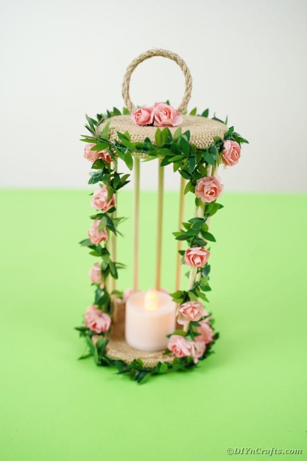 Birdcage candle holder on green table