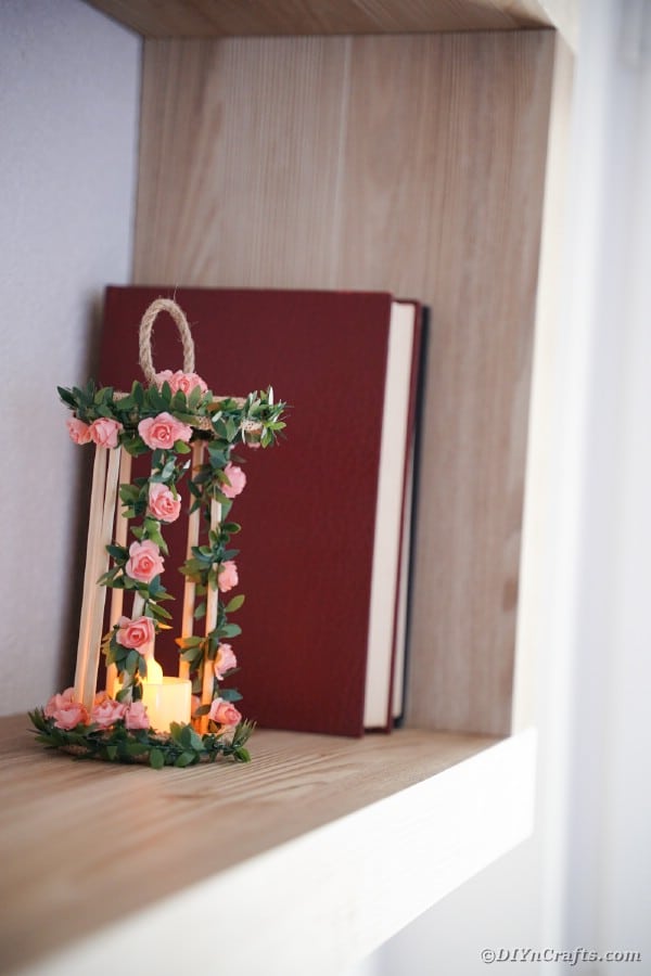 Birdcage candle holder on shelf