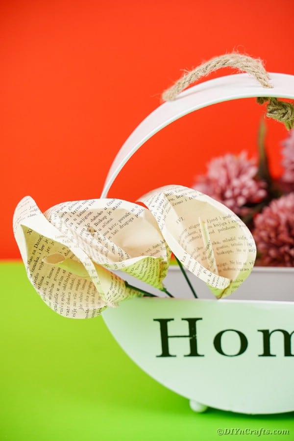 Paper flowers in basket with home on front