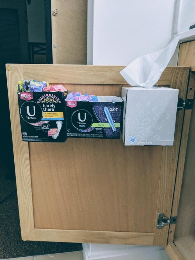 Tampon boxes on bathroom cabinet