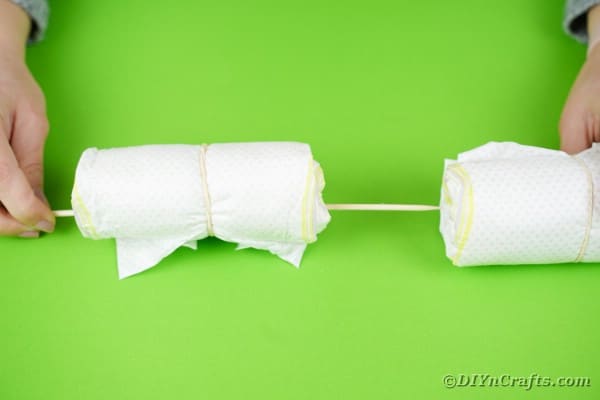 Adding dowel into diaper