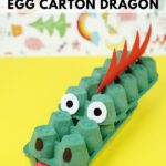 Egg carton dragon on yellow table
