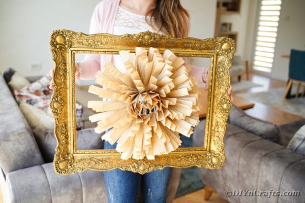 Woman holding old book page paper flower frame art