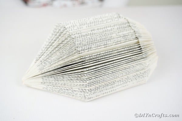Folded book on white table