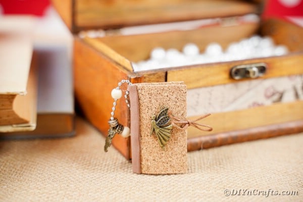 Mini book against wooden chest