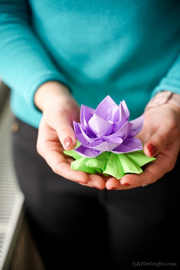 Woman holding paper lotus