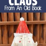 Book santa claus in front of wooden slats