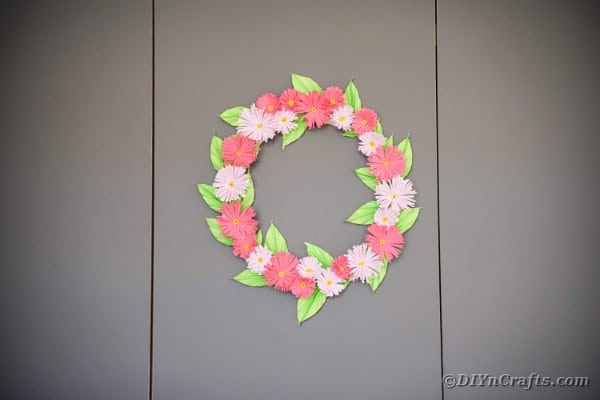 Flower wreath on gray wall