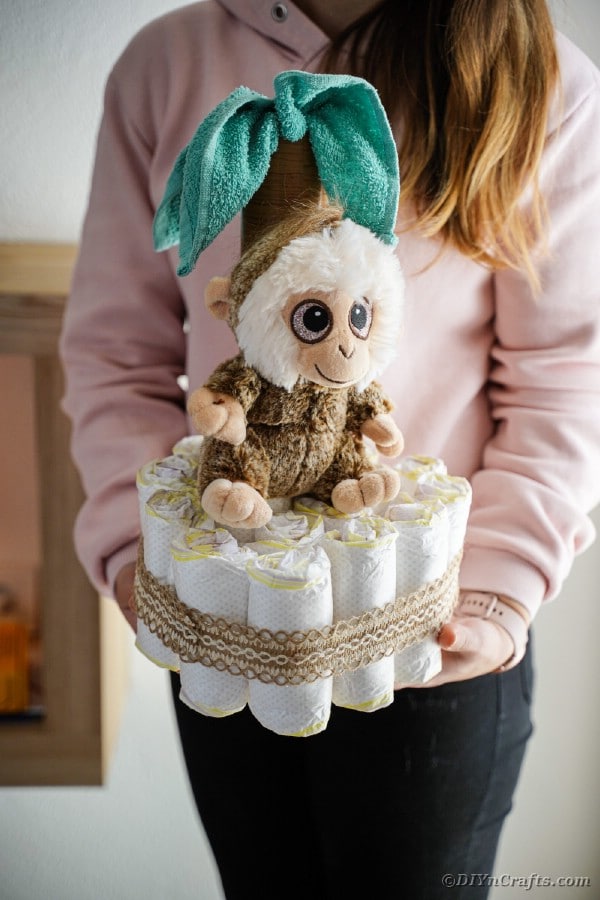 Woman holding diaper cake