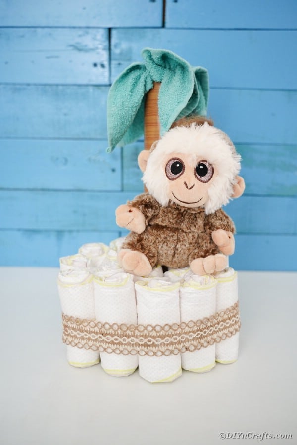 Palm tree diaper cake by blue wall