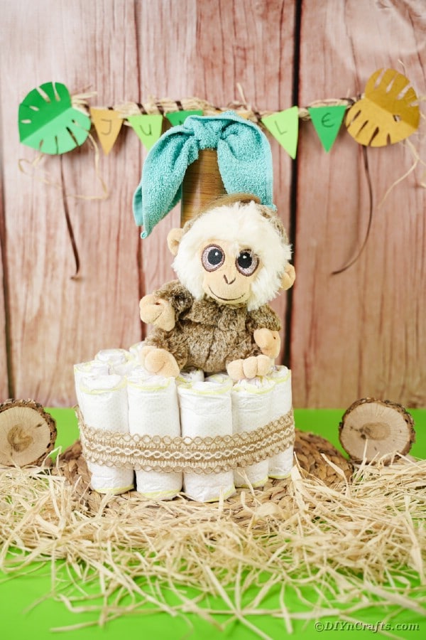 Diaper cake in front of wood wall