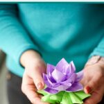 Woman holding paper lotus