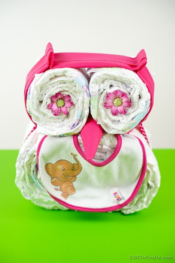 Owl diaper cake on green table