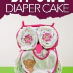 Owl diaper cake on green table