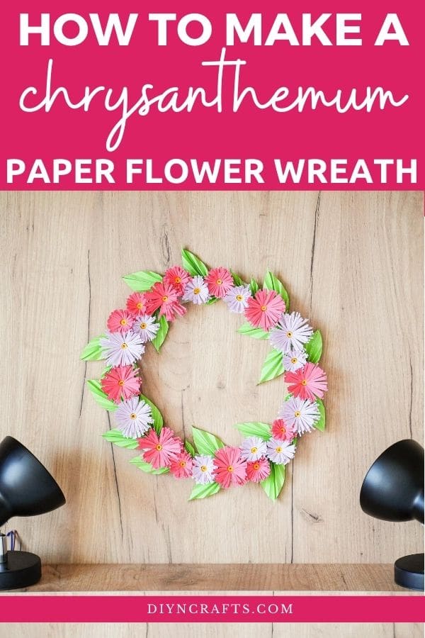 Flower wreath on wood wall with lights