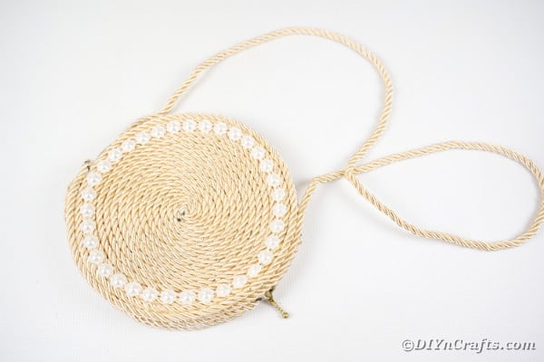 Purse rope on white surface