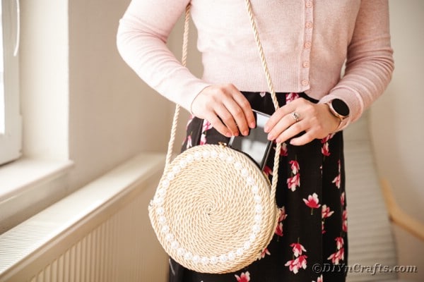 Woman wearing rope purse