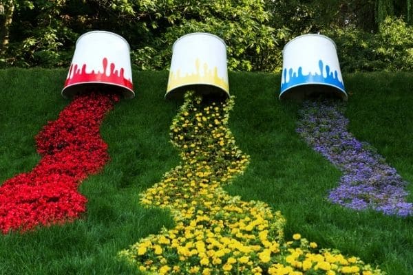 Paint buckets spilling flowers