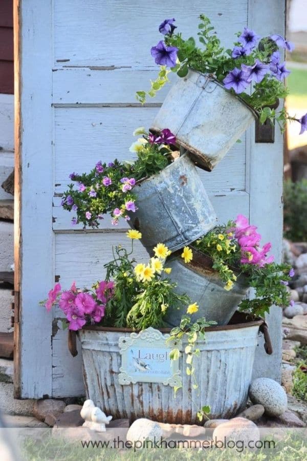 Topsy turvy galvanized buckets of flowers