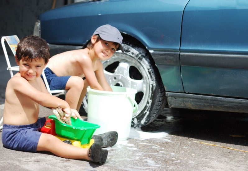 Kids cleaning the car.