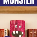 Old book pink monster craft on stack of books