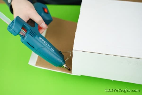 Gluing end onto paper box