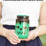 Woman holding a mason jar frankenstein