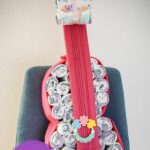 Guitar diaper cake on blue chair